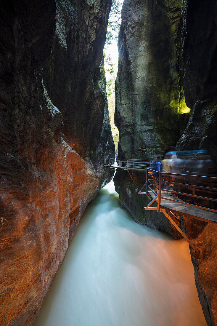 Water of creek flows in the narrow limestone gorge carved by river, Aare Gorge, Bernese Oberland, Canton of Uri, Switzerland, Europe