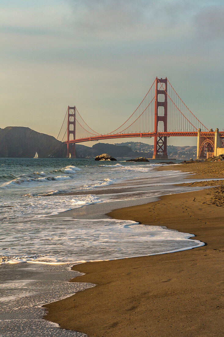 Golden Gate Bridge at sunset shot from Baker Beach, San Francisco, Marin County, California, USA