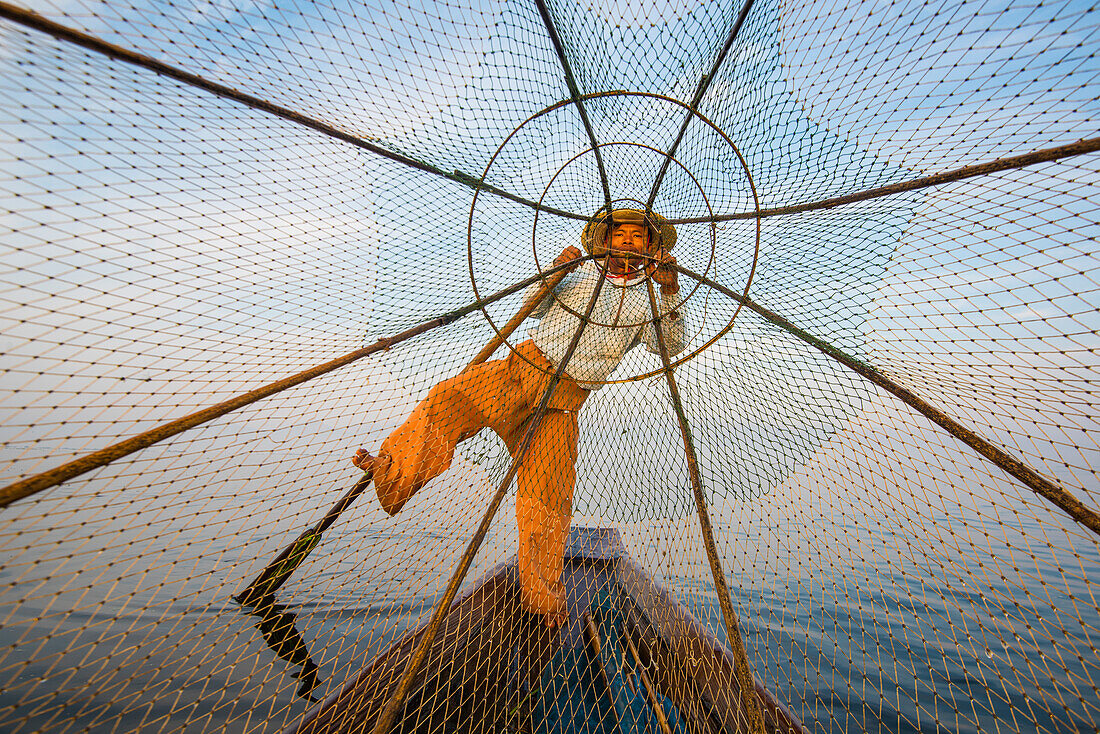 Inle lake, Nyaungshwe, Shan state, Myanmar, Fisherman looking through the fishing net