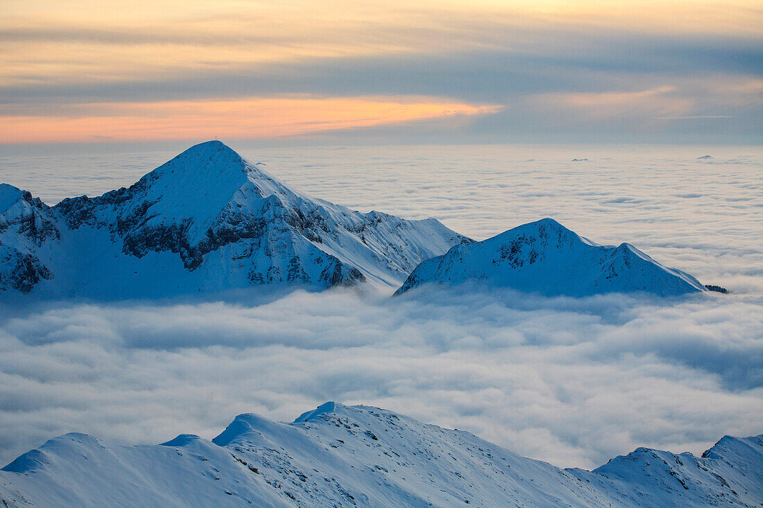 Sunset en fog on the Orobie alps, Lombardy, Italy