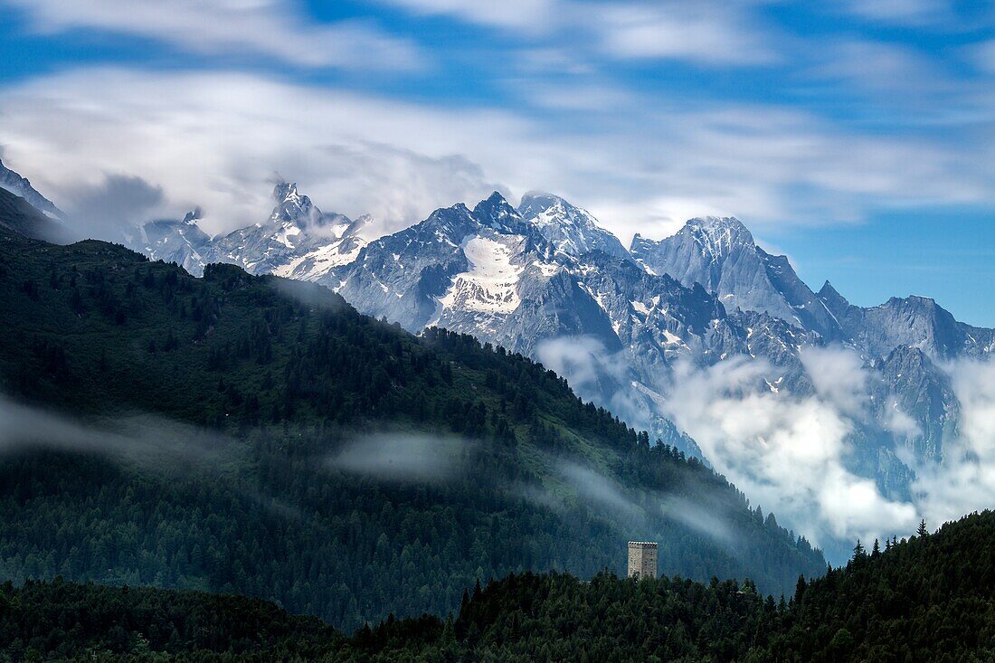 Fog on Tower Belvedere with Pizzo Badile surrounded by clouds, Maloja Pass, Engadine, Canton of Graubunden, Switzerland Europe