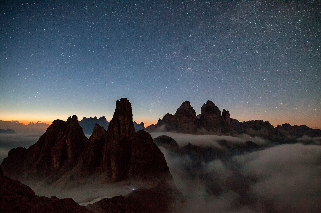 Summer night with view on the Wund Tower of Cadini di Misurina with the three peaks of Lavaredo under the Milky Way, Cadini di Misurina, Dolomites, Veneto, Italy