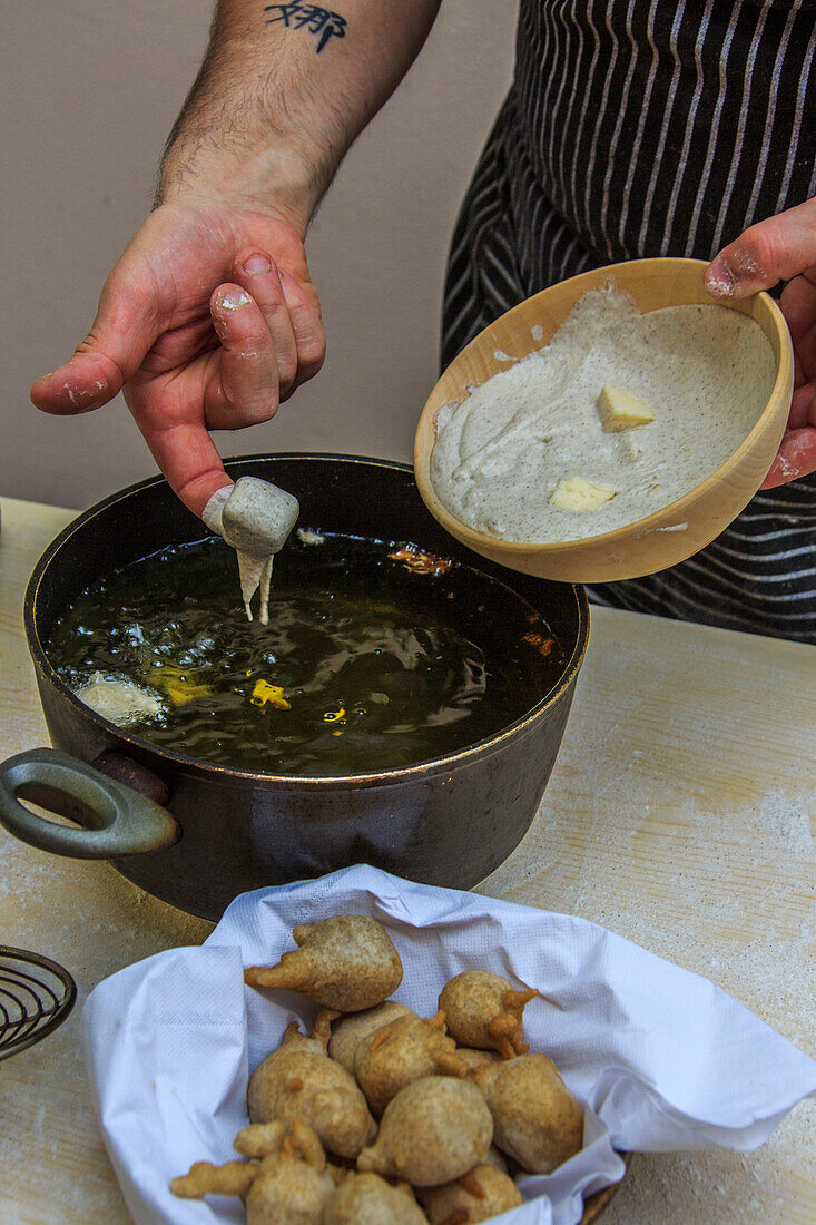 The chef is ready to cook Sciatt, Lombardy, Italy, Europe