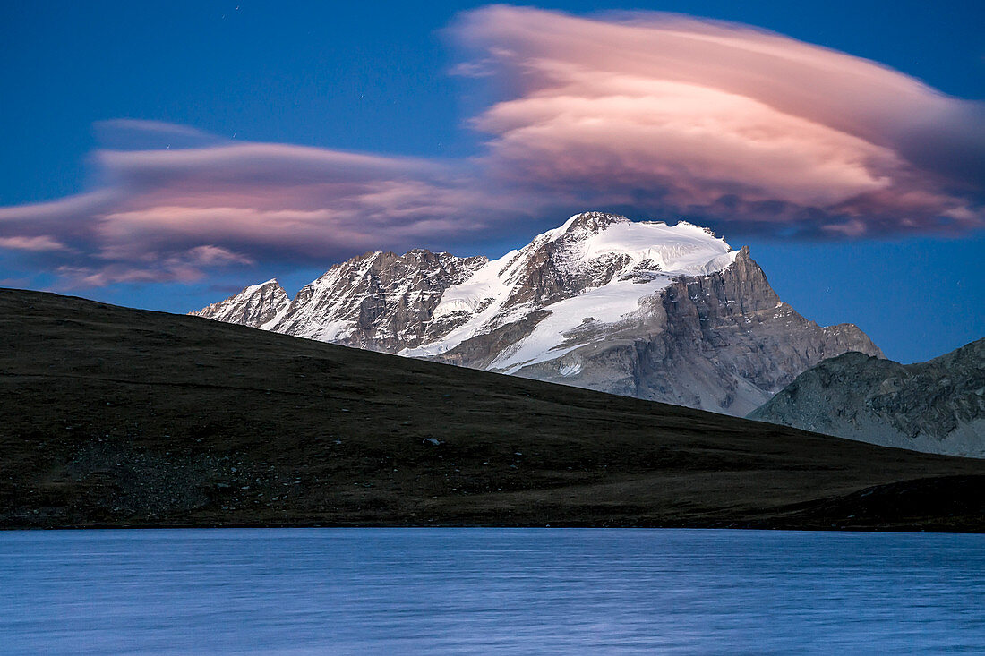 Pink clouds after sunset on Rosset lake at an altitude of 2709 meters, Gran Paradiso national park, Alpi Graie