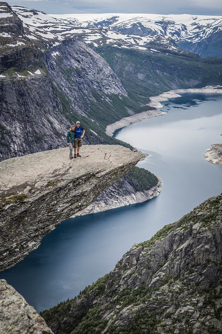 Peolpe standing on the top of Trolltunga, Odda, Hardangerfhord, southern Norway