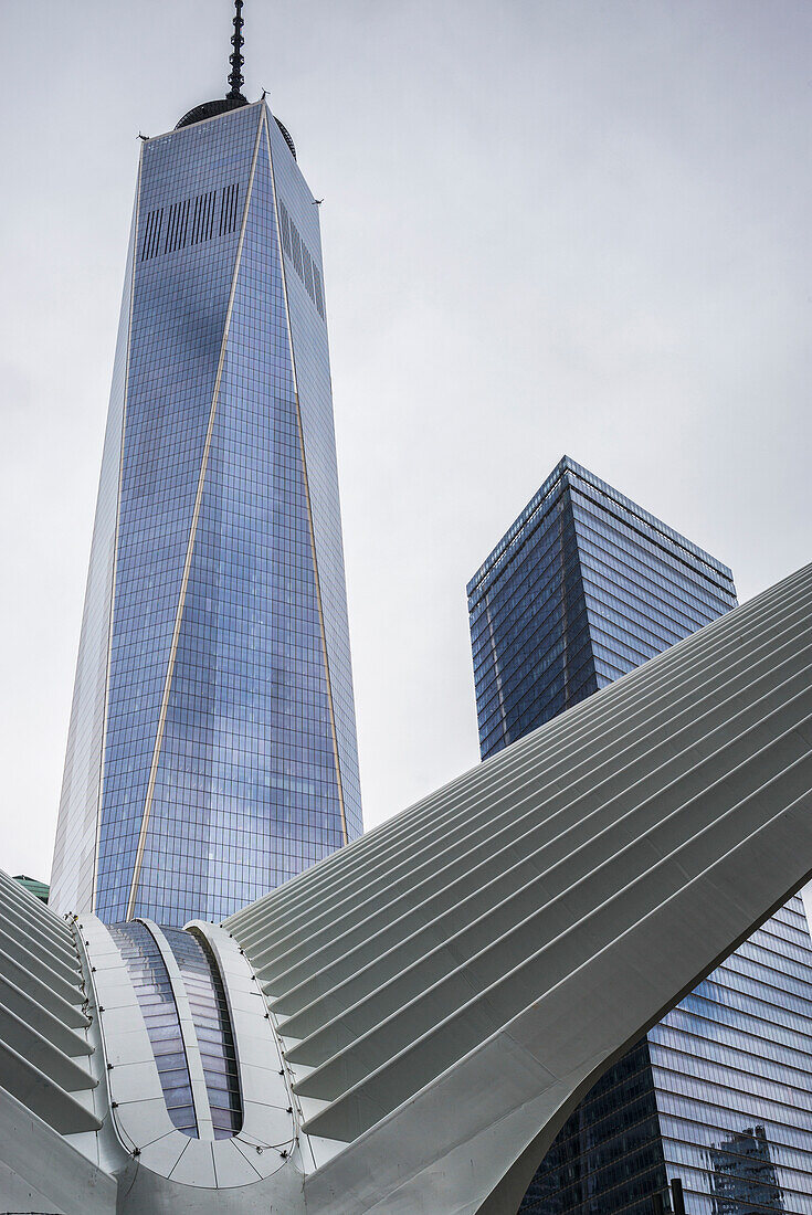 'Modern structure with white prongs like wings, skyscraper and One World Trade Center; New York City, New York, United States of America'