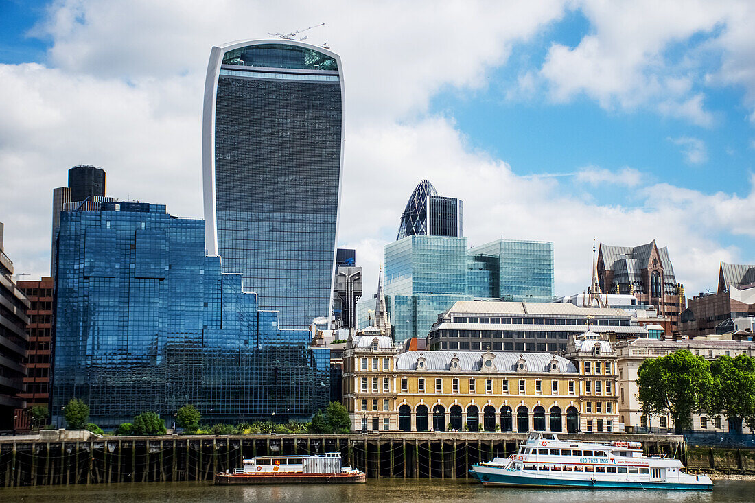 'Looking across the River Thames to the City of London (The Walkie Talkie building and The Gherkin, centre); London, England'