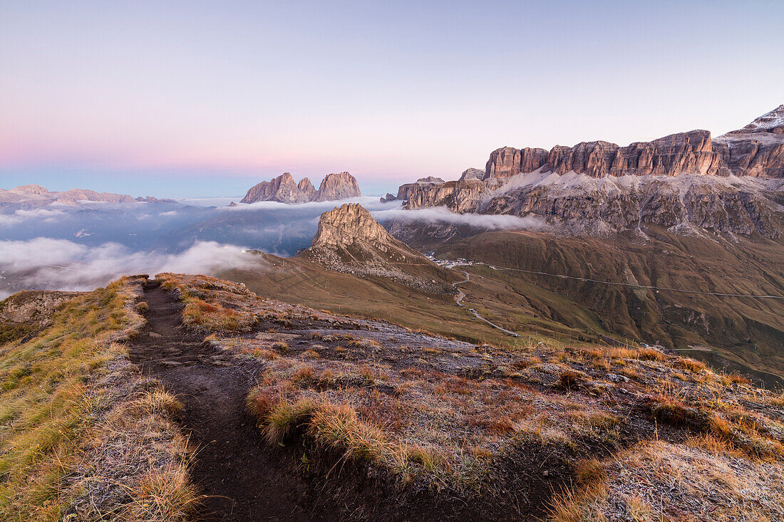 Pink sky and mist on Sass Beca and Sassolungo seen from Cima Belvedere, Canazei, Val di Fassa, Trentino-Alto Adige, Italy, Europe