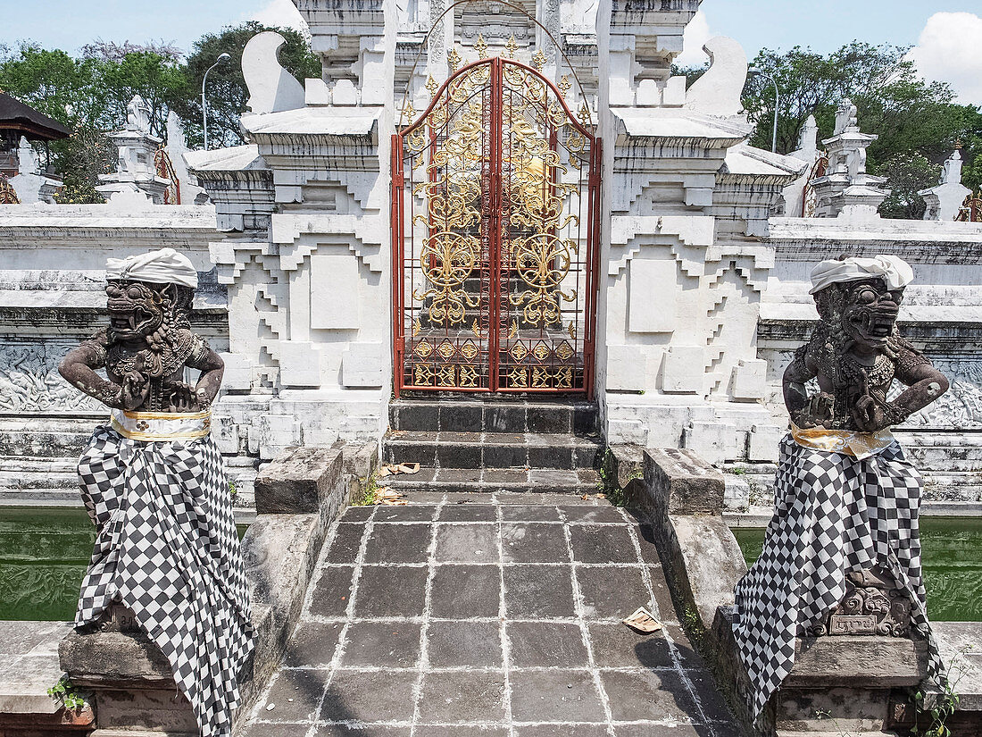 Temple gate and guardians, Denpasar, Bali, Indonesia, Southeast Asia, Asia