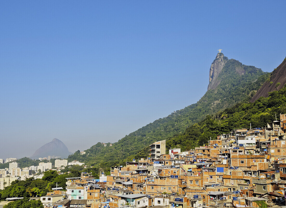 View of the Favela Santa Marta with Corcovado and the Christ statue behind, Rio de Janeiro, Brazil, South America