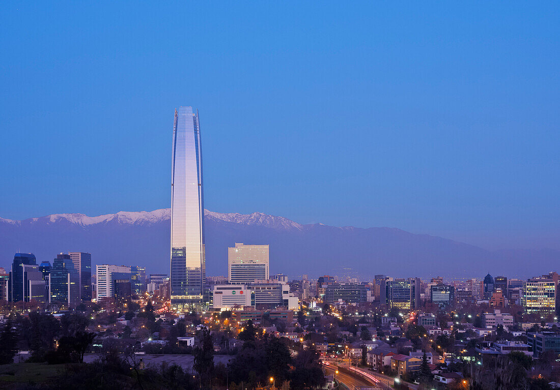 Twilight view from the Parque Metropolitano towards the high rise buildings and Costanera Center Tower, Santiago, Chile, South America