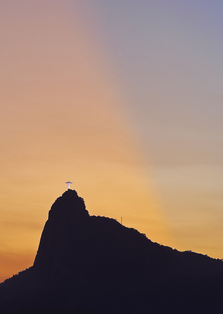 Sunset view of Christ the Redeemer statue and Corcovado Mountain, Rio de Janeiro, Brazil, South America