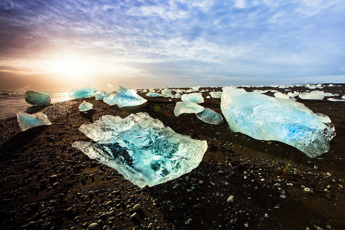 Icebergs on a black sand volcanic beach next to the Jokulsarlon glacial lake in Vatnajokull National Park in southeast Iceland, Polar Regions