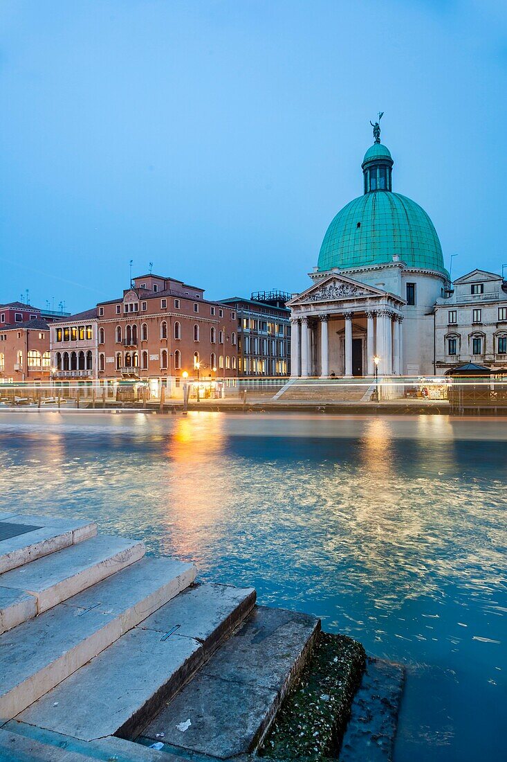 Night falls on Grand Canal in Venice, Italy. San Simeone Piccolo church in the background.