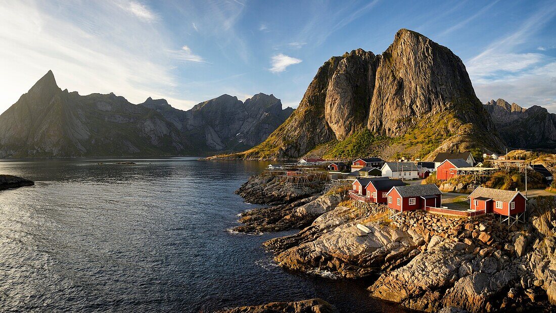 Norway, Nordland, Lofoten islands, Moskenesoy island, the fishing village of Hamnoy, traditional fishermen cabins built on stilts (rorbu, rorbuer) at sunset.