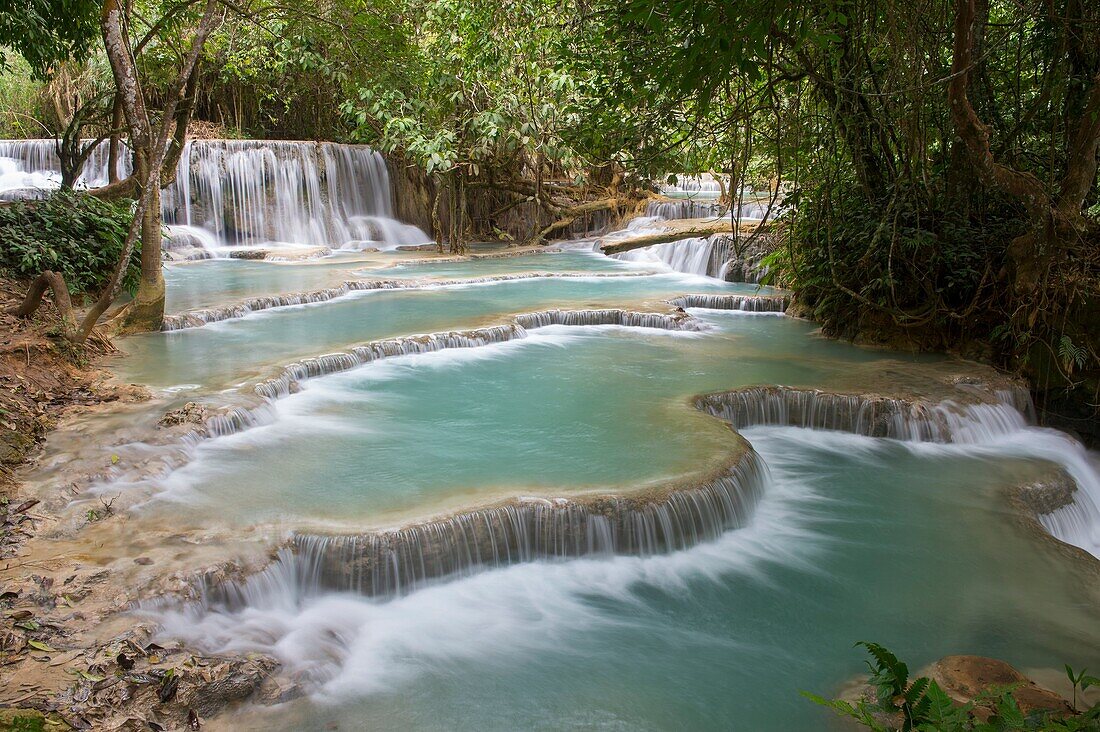 Cascades and turquoise blue pools of the Kuang Si Falls near Luang Prabang in Laos.
