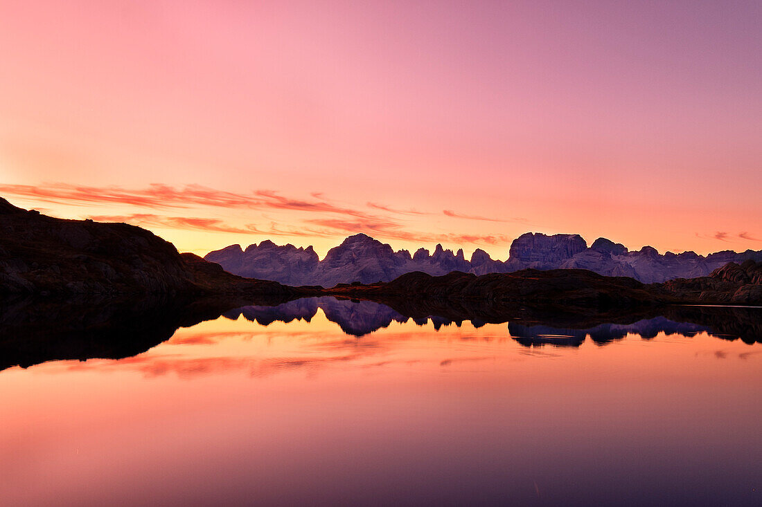 Val Nambrone, Adamello Brenta Park, Trentino Alto Adige, Italy, The Brenta Dolomites are reflected in the waters of Black Lake at sunrise