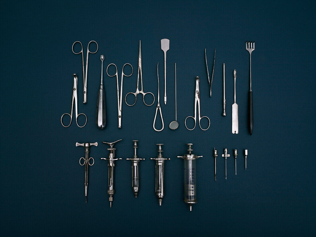 Directly above shot of various medical tools on blue background