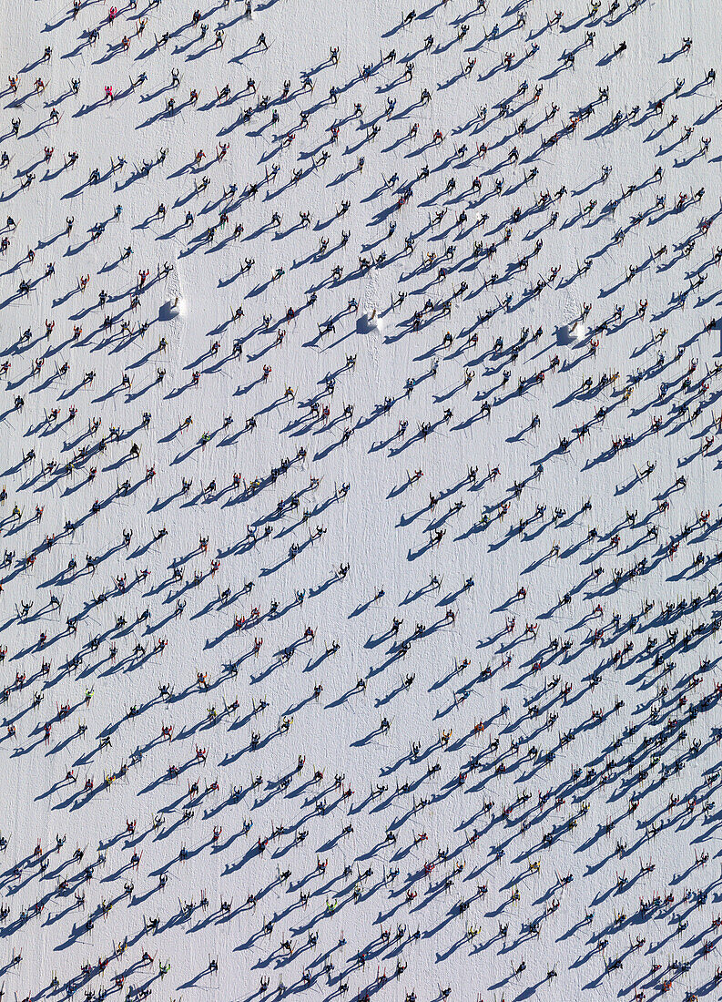 Aerial view of skiers on snow covered field