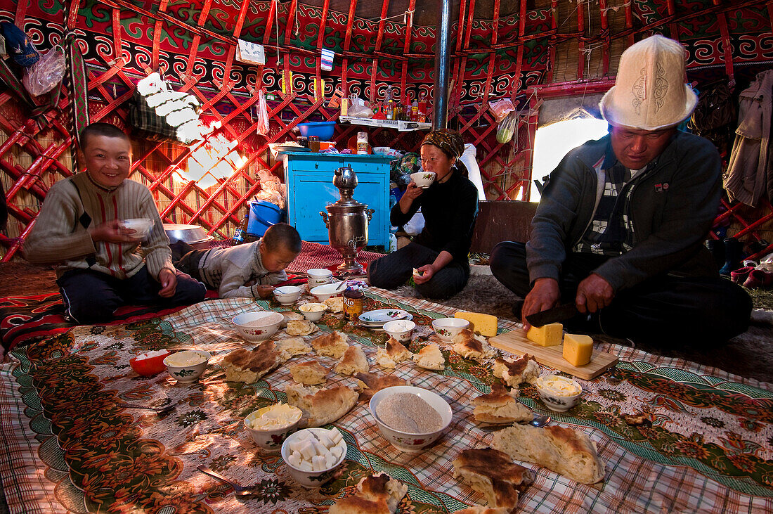 'Kyrgyzstan, Issyk Kul Province (Ysyk-Kol), Juuku valley, generous kyrgyz breakfast made of chai (tea), cream, butter and home-made cheese with the bread named ''koumkurme'''