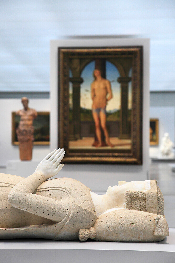 France, Northern France, Lens, Lens Louvre museum, the great exhibition room (architectes Kazuyo Sejima/Ryue Nishizawa©Sanaa) Painting: Saint Sebastion by Pietro Perugino. Foreground: rfagment of a mortuary monument