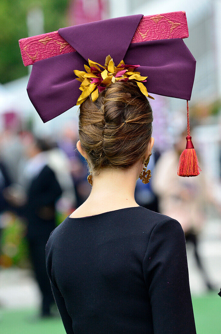 France, Paris 16th district, Longchamp Racecourse, Qatar Prix de l'Arc de Triomphe on October 4th and 5th 2014, Elegant and  fashionable young lady seen from behind wearing a hat