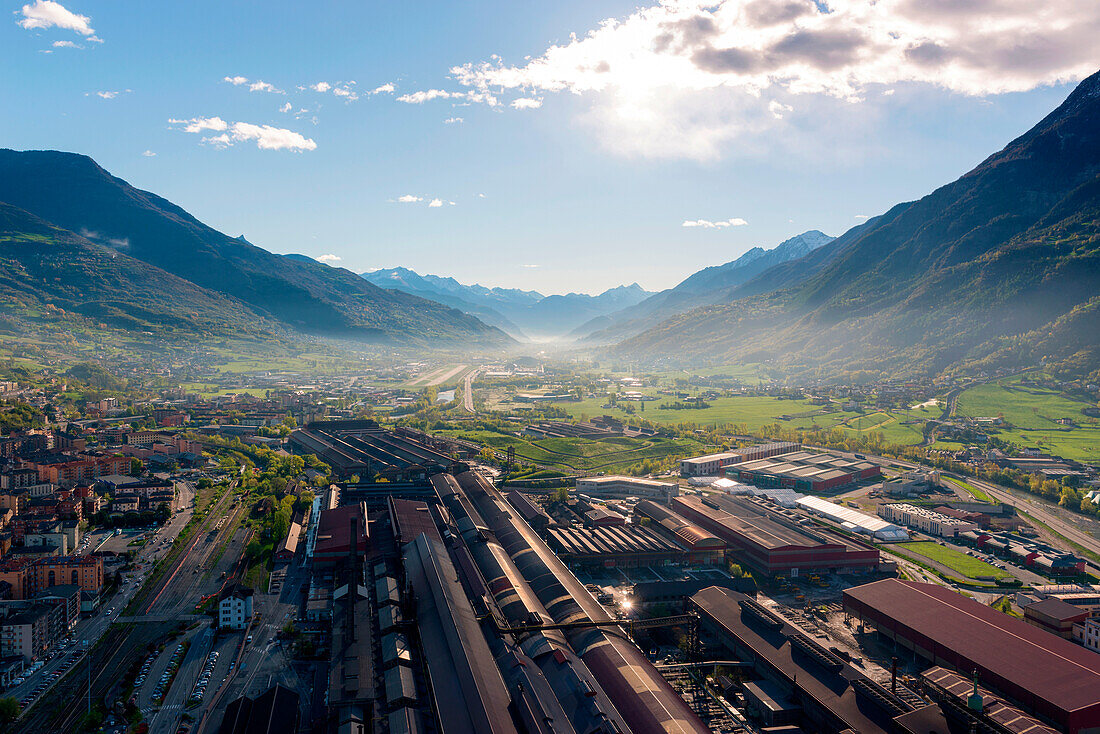 Aerial view of Aosta city, in the foreground Steel Factory, Aosta Valley, Italy, Europe