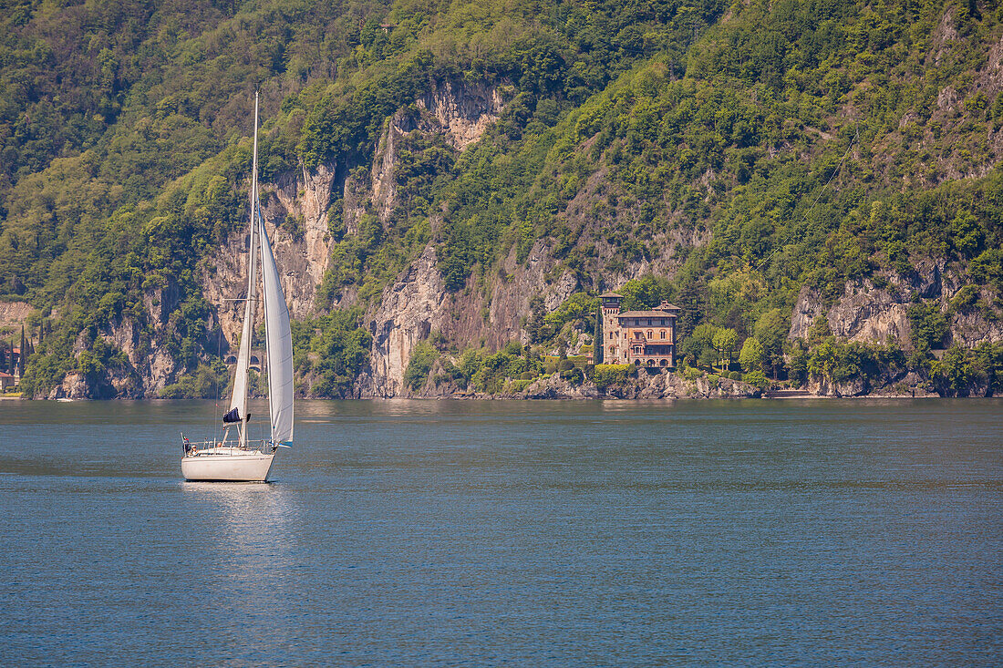 Sail boat in front of Villa Gaeta, Lake Como, Lombardy, Italy