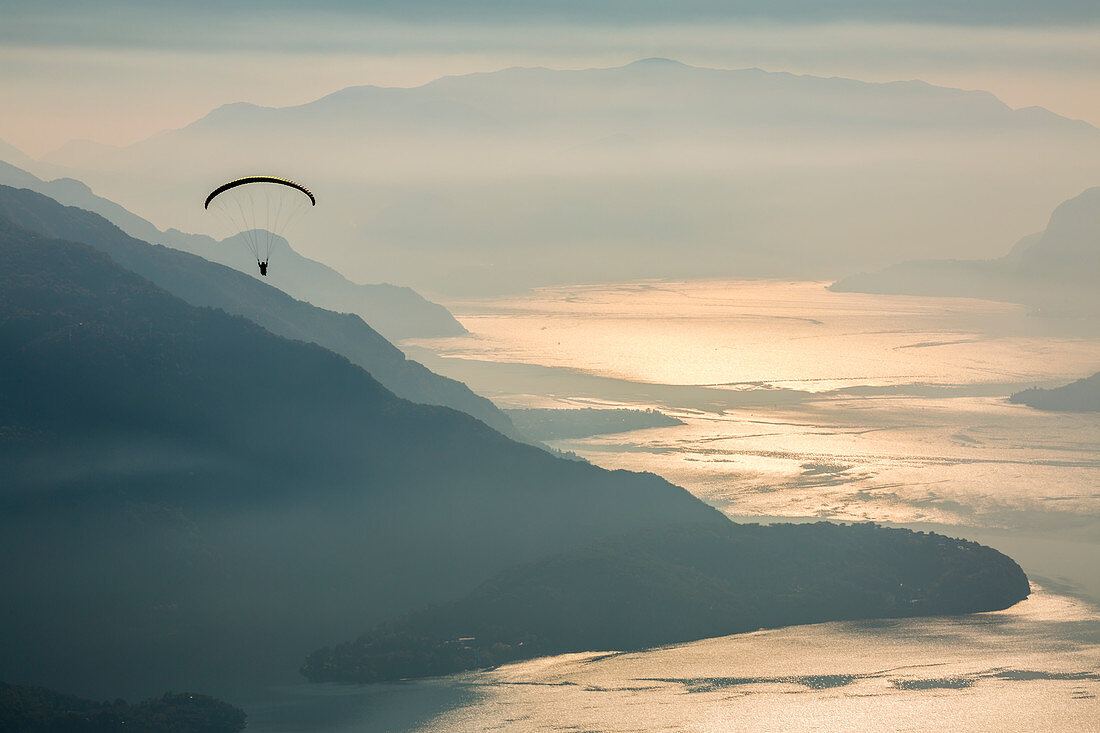 Paragliding over Lake Como and the surroundings mountains, Alto Lario, Como, Lombardy, Italy, Europe