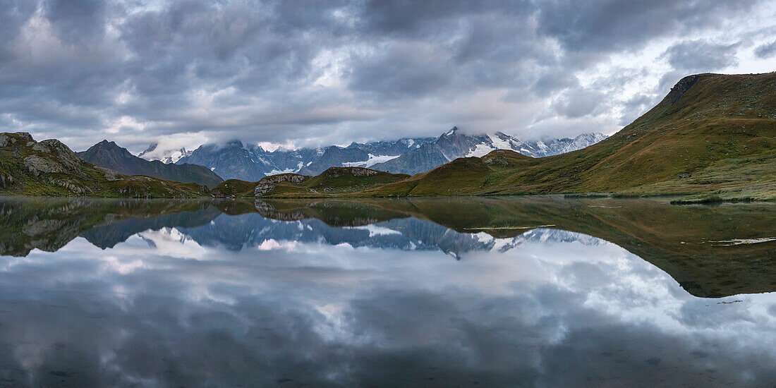 Cloudy sky over Fenetre Lake and the Mont Blanc massif, Ferret valley, Switzerland