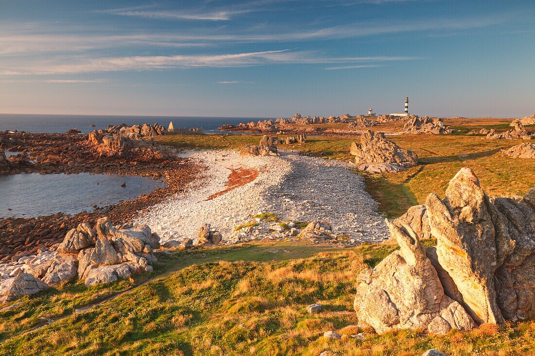 Ouessant island, Brittany, France, The point most westerly of the island at sunset, In background, you can see the Creach lighthouse, one of the most powerful lighthouses in the world