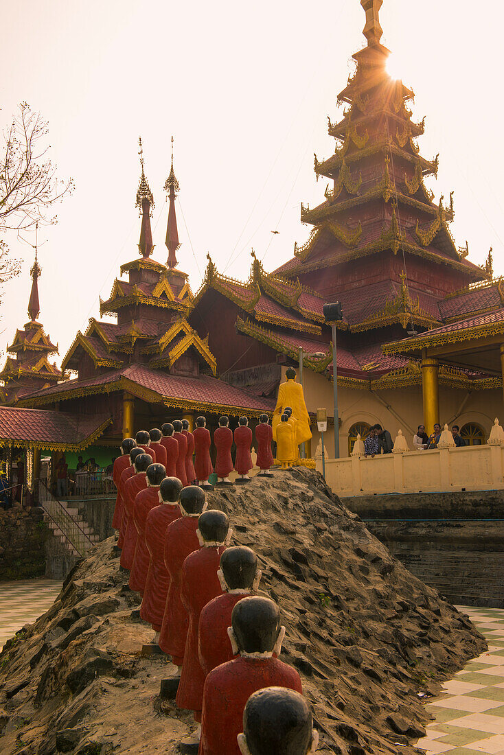 Rakhine state, Myanmar, Monks statues lined up in a pagoda