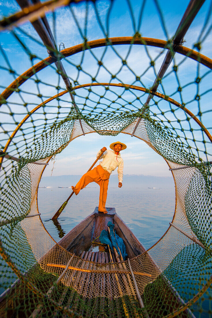 Inle lake, Nyaungshwe township, Taunggyi district, Myanmar Burma , Local fisherman through the typical conic fishing net