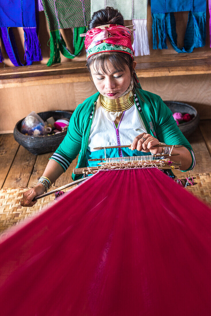 Inle lake, Nyaungshwe township, Taunggyi district, Myanmar Burma , Kayan Padaung  woman weaving on a shop