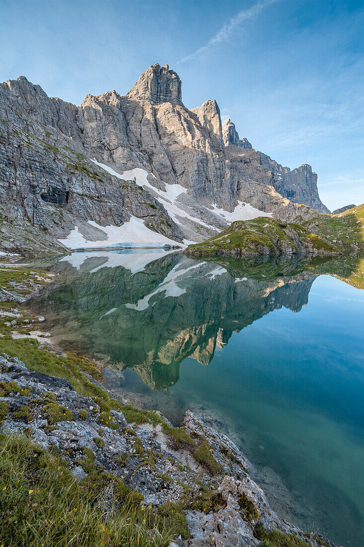 Europe, Italy, Veneto, Belluno, The towers of mount Civetta reflected in the Lake Coldai on a clear summer morning, Civetta group, Dolomites