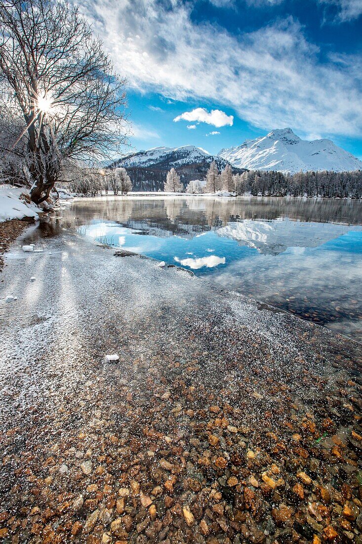 Ice covering the surface of Lake Sils Engadine, Switzerland Europe