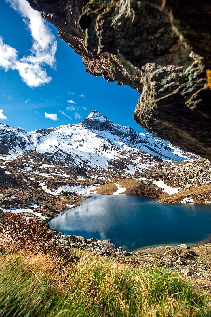 Overlooking the lake of Campagneda with the Pizzo Scalino still covered in snow in the background, Valmalenco, Valtellina Lombardy Italy Europe