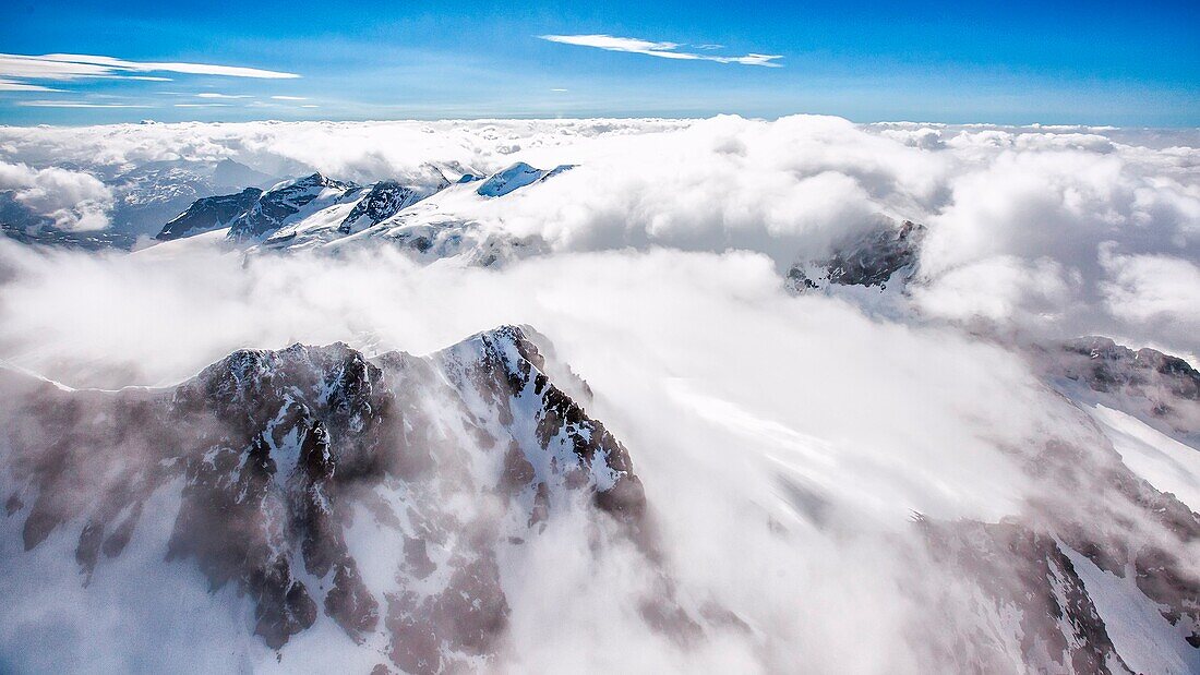 Aerial view of Piz Bernina covered with clouds, Valmalenco, Valtellina, Italy