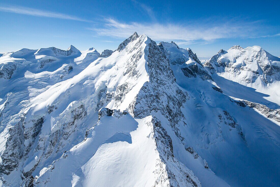 Aerial view of the long crest of ice and rock that takes to Pizzo Bernina, Engadine, Canton Grigioni, Switzerland