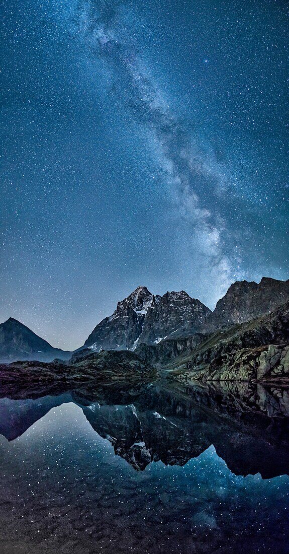 The milky way reflected in Lake Superior near Mount Monviso, Cozian Alps, Piedmont, Italy