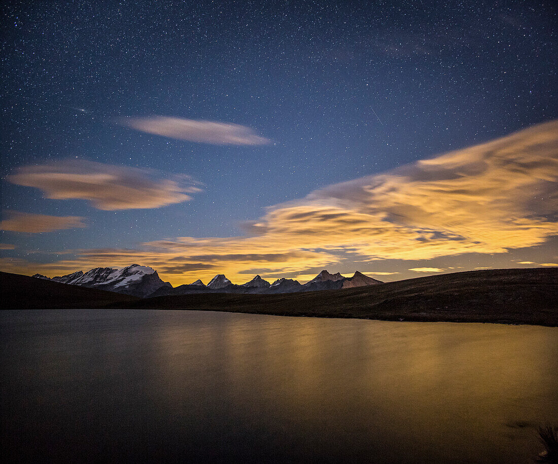 Starry night on Gran Paradiso range view from Lake Rosset, Alpi Graie, Hill of Nivolet