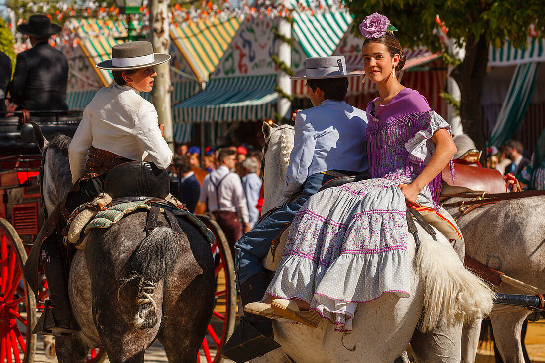 Horseriding couple at the Feria de Abril, Seville Fair, spring festival, Sevilla, Seville, Andalucia, Spain, Europe