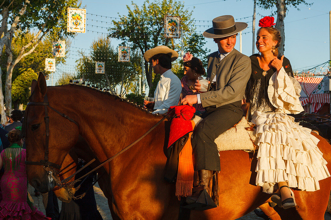 horseriding couple, horse, Feria de Abril, Seville Fair, spring festival, Sevilla, Seville, Andalucia, Spain, Europe