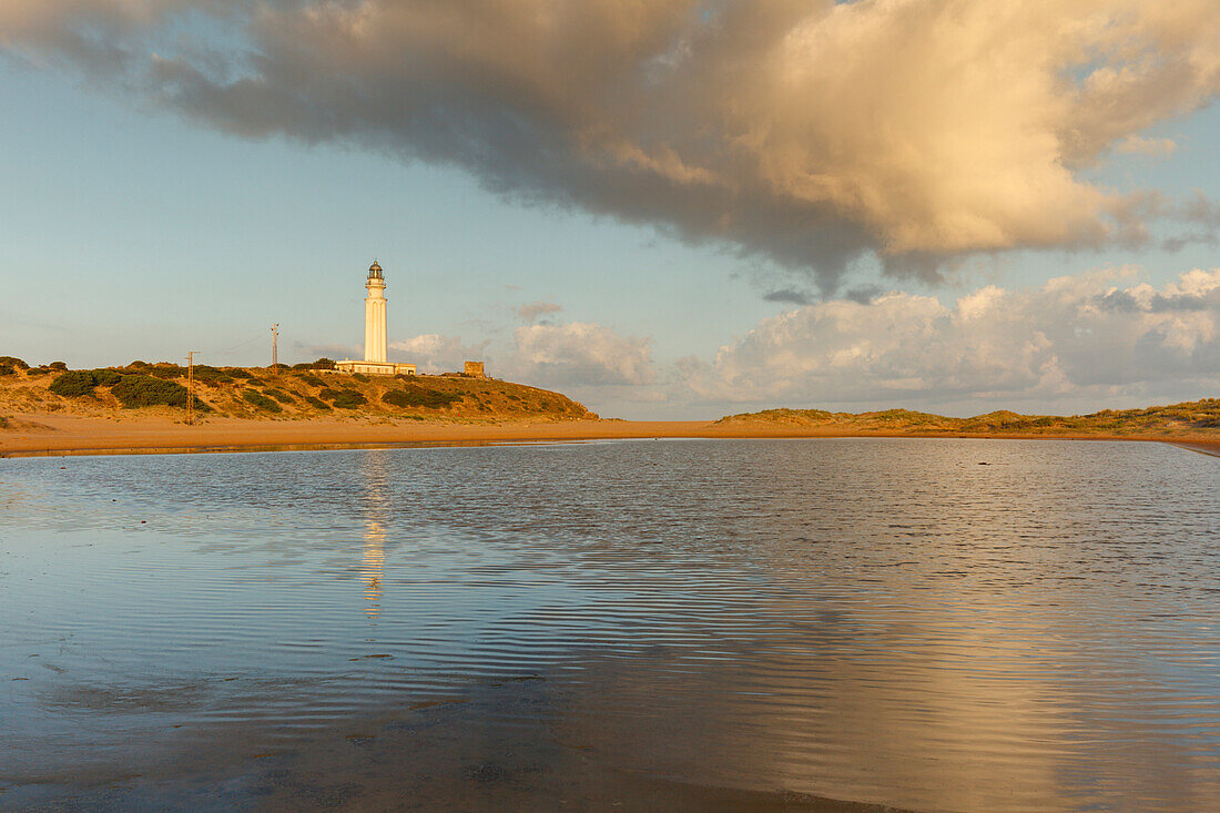 lighthouse, water reflection, Cabo de Trafalgar near Los Canos de Meca, near Vejer de la Frontera, Costa de la Luz, Atlantic Ocean, Cadiz province, Andalucia, Spain, Europe