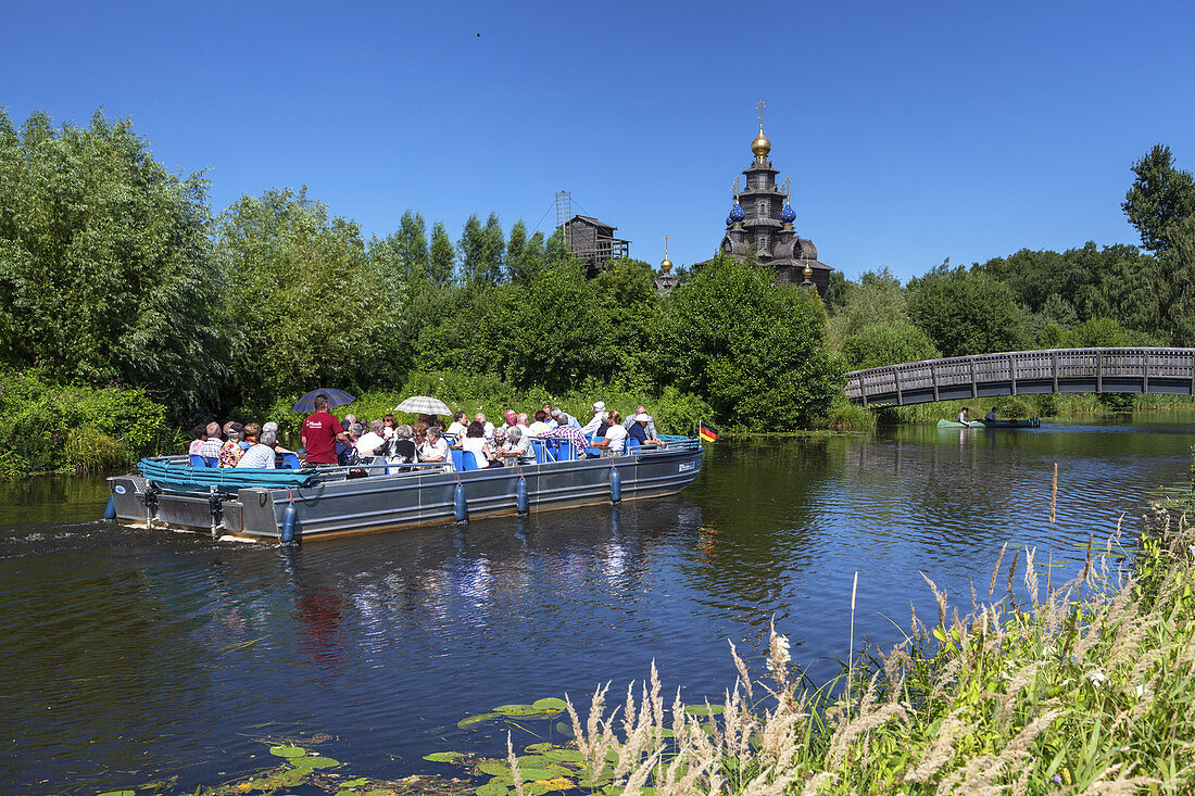 Boat on the river Ise  in front of the mill museum in Gifhorn, Lower Saxony, Northern Germany, Germany, Europe