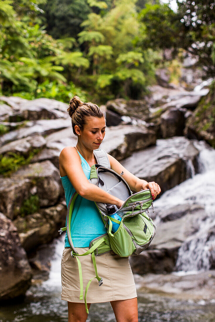 Portrait Of A Woman Standing In Front Of Waterfall In Puerto Rico