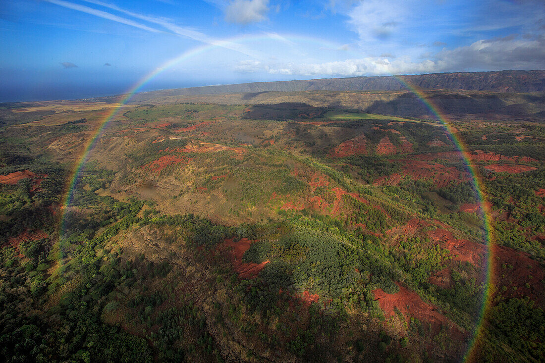 A Full Circle Rainbow Hovers Over The Hawaiian Landscape