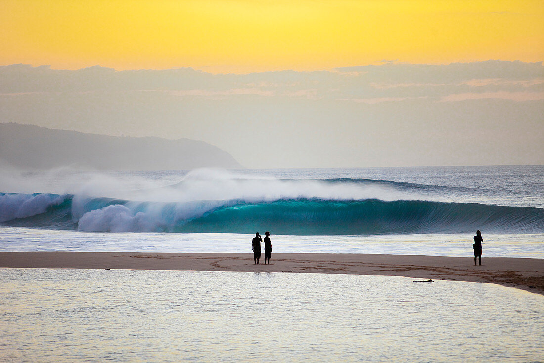 Silhouette Of People Watching The Waves At Pipeline On The North Shore Of Oahu