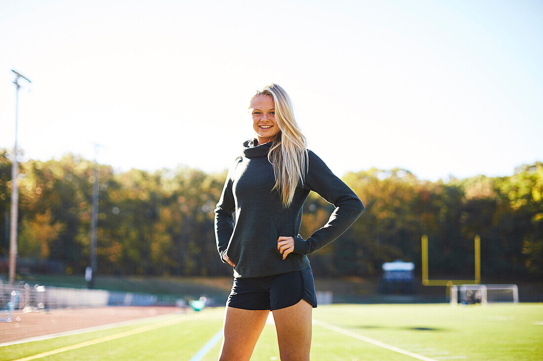 Portrait Of A Female Athlete Standing On The Ground
