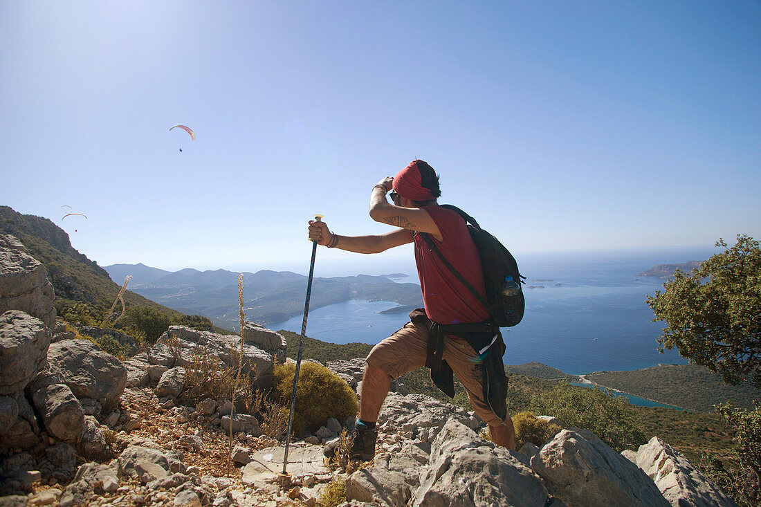 A Male Climber Exploring Paragliding During Mountain Trekking At Kas, Antalya, Turkey